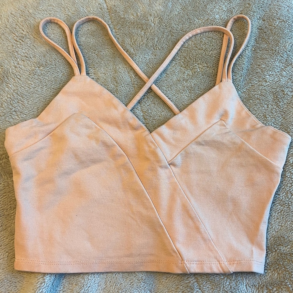 Peach color crop top with razor crossed back